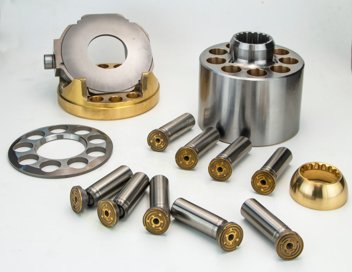 Hydraulic pump components and pistons laid out for inspection