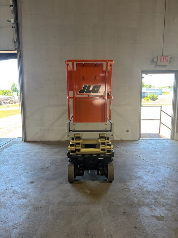 JLG 1930ES scissor lift parked in the AWPS shop bay